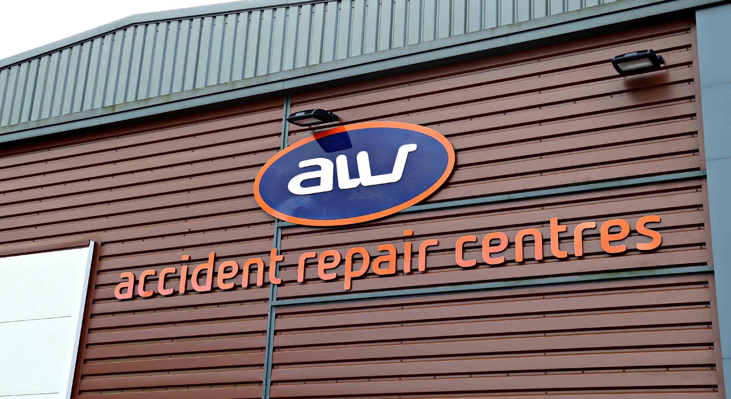 Image of the building with AW Repair logo